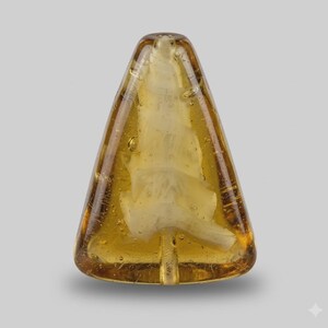 May include: A transparent, amber-colored glass Christmas tree ornament. The tree-shaped ornament has a textured, white interior and small air bubbles throughout the glass. The ornament has a small, vertical indentation at the bottom.