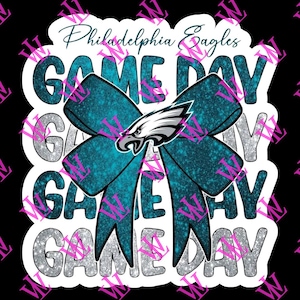 Peut inclure: Un autocollant blanc avec un nœud bleu sarcelle et des paillettes. Le nœud a un logo des Eagles de Philadelphie au centre. Le texte "Philadelphia Eagles Game Day" est écrit sur l'autocollant.