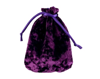 May include: A purple velvet drawstring bag with a gathered top and a long cord.