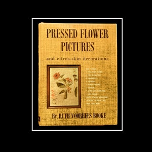 May include: A vintage book titled "Pressed Flower Pictures and citrus-skin decorations" by Ruth Voorhees Booke. The cover features a pressed flower illustration and a list of craft projects.