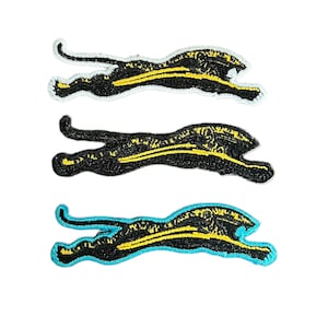 May include: Three black and yellow embroidered iron-on patches of a running panther. The patches have white stitching around the edges. The bottom patch has a turquoise blue outline.