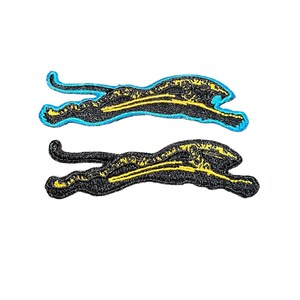 May include: Two black embroidered patches of a cheetah running, outlined in blue and yellow.