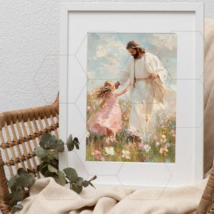 May include: A framed art print depicts a figure in white robes holding the hand of a young girl in a pink dress. They stand in a field of colorful wildflowers under a cloudy sky. The artwork is displayed in a white frame.