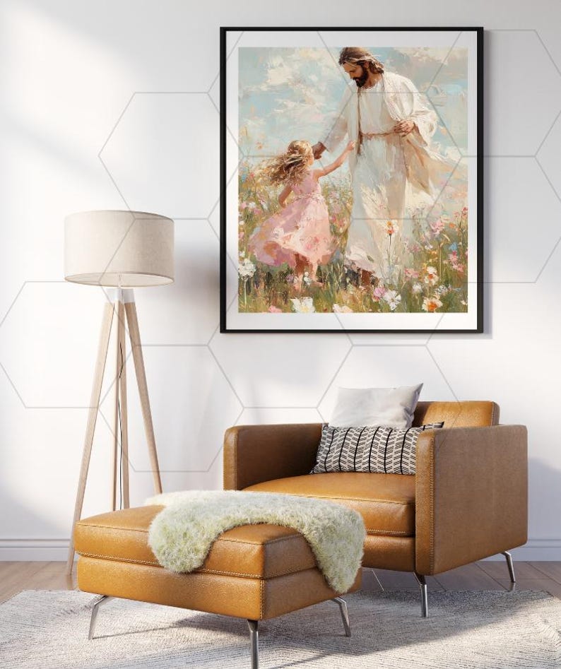 May include: Framed art print depicting a figure in white robes holding the hand of a young girl in a pink dress. The artwork is set in a field of flowers with a blue sky background. The print is displayed above a brown leather chair and ottoman.