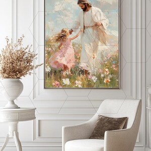 May include: A framed painting depicts a figure in white robes with a crown of thorns, holding hands with a young girl in a pink dress. The artwork is set in a field of wildflowers, with a soft, ethereal quality.