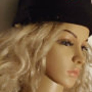 May include: Black fleece hat with a red embroidered arrow and the word "TWIST" on the front.