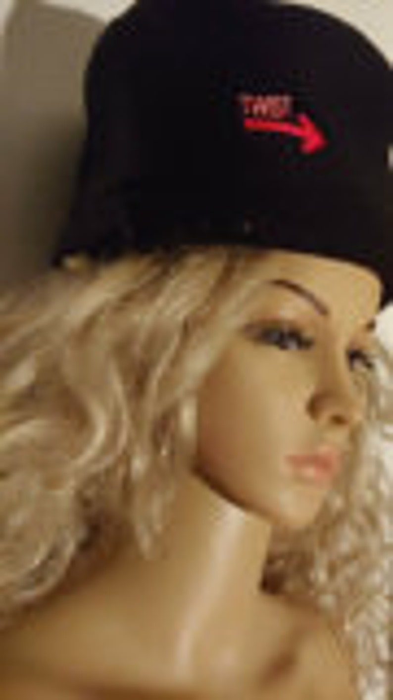 May include: Black fleece hat with a red embroidered arrow and the word "TWIST" on the front.