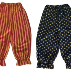 May include: Two pairs of clown pants. One pair is red and gold striped, the other is navy blue with gold stars.