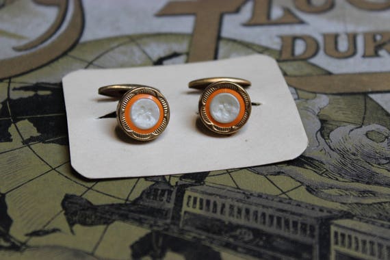 Ancienne paire de boutons de manchettes vintage métal doré
