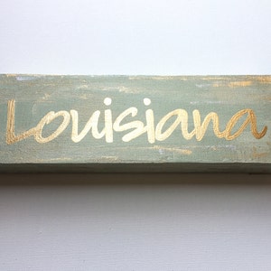 Louisiana" gold leaf on antique white, The Louisiana Collection, 4"x12"