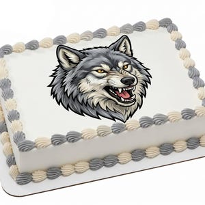 May include: A rectangular cake with white frosting, decorated with a detailed image of a snarling wolf's head in shades of gray and black. The cake's edges are adorned with alternating gray and cream-colored piped frosting.