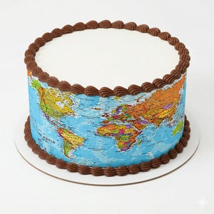May include: A round cake decorated with a world map design. The cake has a white top and a blue base with a colorful map of the world. The edges are decorated with brown frosting.