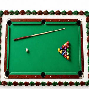 May include: A rectangular cake decorated to resemble a pool table with a green surface, brown wooden-look rails, a white cue ball, a triangle rack of colorful billiard balls, and a single cue stick, all bordered by green and brown frosting shells.