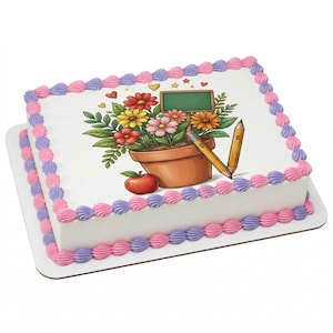 May include: A rectangular cake with white frosting, decorated with pink and purple frosting swirls. The top features a colorful illustration of flowers in a pot, a chalkboard, pencils, and an apple. The cake is on a white cardboard base.
