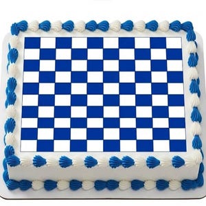 May include: A rectangular cake with a blue and white checkerboard design on top. The cake is decorated with white and blue frosting around the edges, creating a festive look. The cake is on a white surface.