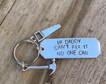May include: Silver keychain with a saw, hammer, and a tag that reads "If Daddy Can't Fix It No One Can".