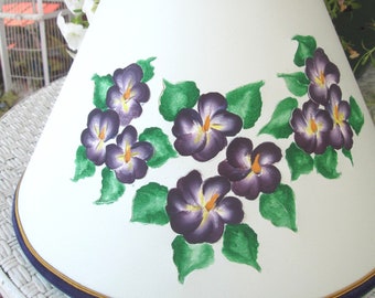 Cut and pierced paper lampshade,hand-painted purple violets, green leaves, round clip-on.5X12X6.75". White paper turns pretty teal when lit!