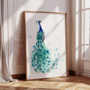 May include: A framed watercolor painting of a peacock standing in profile. The bird features a deep blue neck and head with a crest, transitioning into a long, flowing tail of teal and green feathers with distinct eye-shaped patterns and splatters.
