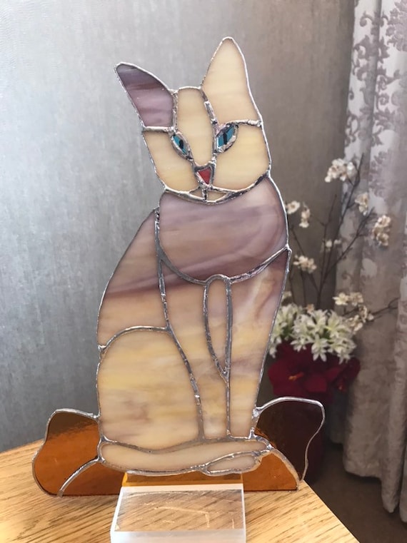 Cat Sitting On Cushion