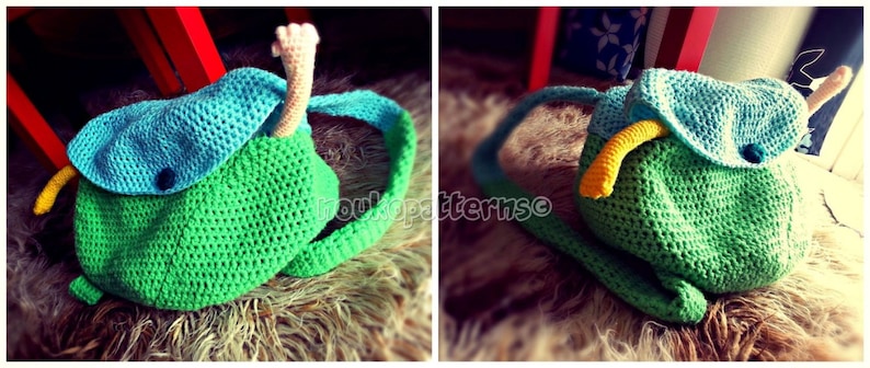 May include: A green and blue crocheted backpack with a yellow and white crocheted snake coming out of the top.
