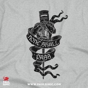 May include: A black and white graphic of a medieval knight holding a sword, with the words "NONE SHALL PASS" on a banner. The knight is wearing a helmet and armour. The design is on a grey background.