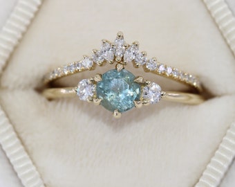 Custom-made 1 carat Round Pastel Blue Montana Sapphire 3 Stone Ring