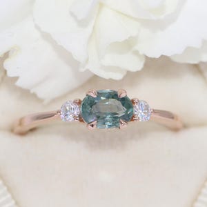 East West Oval Teal Blue Natural Montana Sapphire 3 Stone Engagement Ring