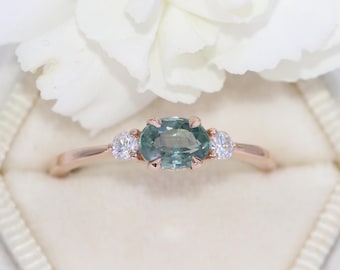 East West Oval Teal Blue Natural Montana Sapphire 3 Stone Engagement Ring