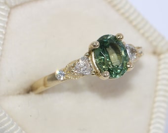 1 carat Oval Green Natural Sapphire and Trillion Natural Diamonds Leaf Pattern Ring