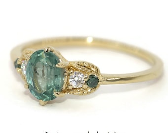 1 carat Teal Pastel Blue Green Oval Unheated Montana Sapphire Hand Engraved Leaf Ring