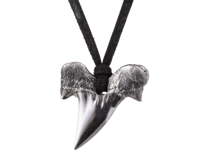 Back image of poured silver shark's tooth pendant and deerskin leather necklace.