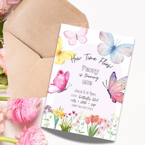 May include: A pink and white invitation with butterflies and flowers. The text reads "How Time Flies! Penny is turning one. June 6 at 1pm. 12345 Butterfly Blvd. City, State, Zip. 123 457 7890."