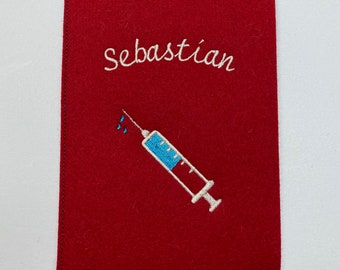 Vaccination certificate, syringe, vaccination passport cover