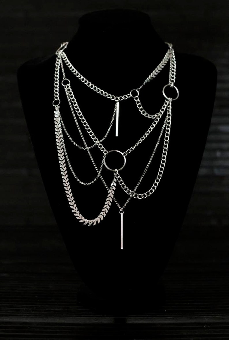 Multi-layered Myril Jewels necklace, cascading chains with central o-ring. Ideal for gothic-chic, Witchcore enthusiasts or as a bold statement piece at rave parties.