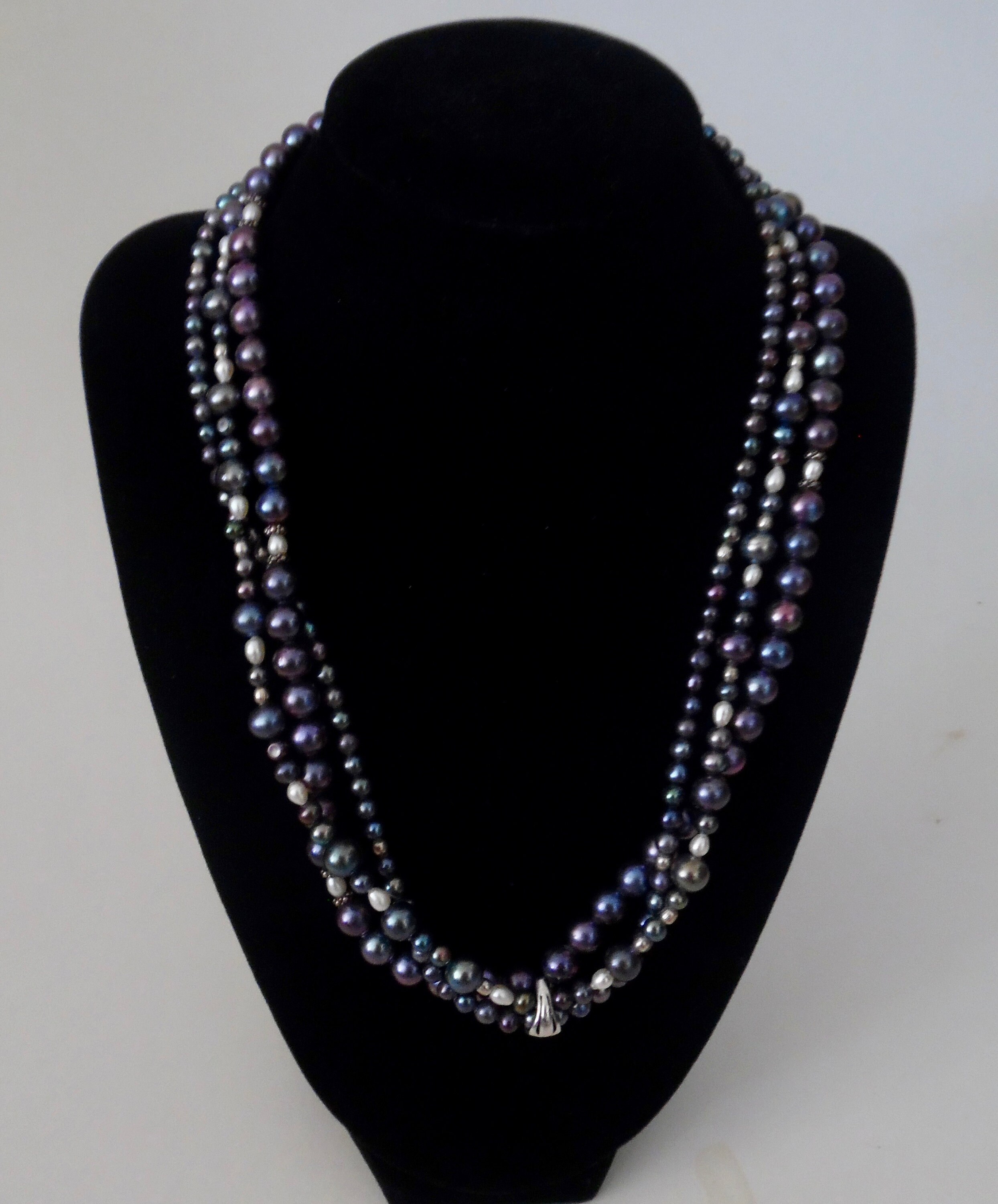 Strand of 2024 black pearls