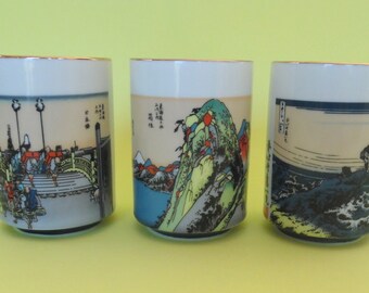JAPANESE YUNOMI TEACUPS Set 3 Traditional Signed White Porcelain Colorful Scenes Gilded Fishing Ocean Characters Mount Fuji Silkscreened