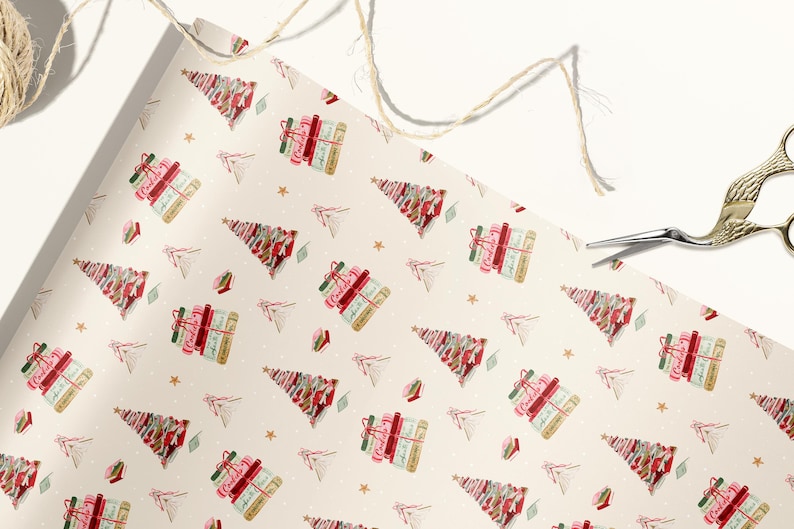 May include: White wrapping paper with a repeating pattern of Christmas trees made of stacked books. The books are red, pink, and green with gold accents. The background is a cream color with small white dots.
