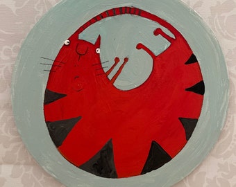 On cardboard, portrait, cat, round