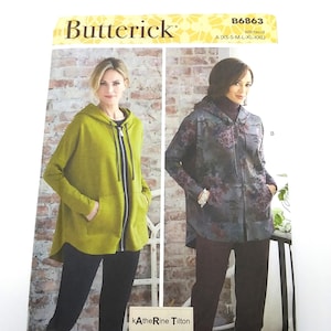 May include: A Butterick sewing pattern, B6863, featuring two women modeling hooded jackets. The pattern includes sizes XS-XXL. The design is by Katherine Tilton and is printed in the USA.