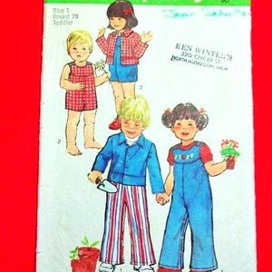 May include: Vintage Simplicity sewing pattern, number 6297, featuring illustrations of children's clothing. The pattern includes a size 1, breast 20, for toddlers. The cover has a green and white design with the text "Simplicity" and the price.
