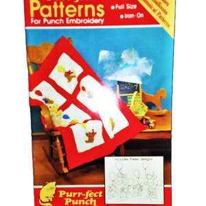 May include: A craft kit box titled "Purr-fect Patterns for Punch Embroidery." The box features a red and white design with teddy bears and balloons. The box also includes the text "Full Size" and "Iron-On."