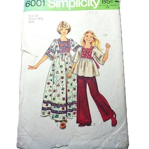 May include: Vintage Simplicity sewing pattern 6001 for girls' dresses and pants. The pattern cover features illustrations of two girls in colorful outfits. The text includes "Size 10, Breast 28 1/2" and the year "1973".