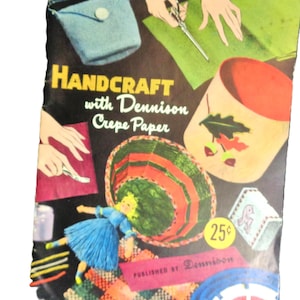May include: Vintage craft book cover featuring the title "Handcraft with Dennison Crepe Paper." The cover showcases illustrations of handmade items, including a purse, a basket, and a doll. The color palette includes black, blue, red, green, and yellow.