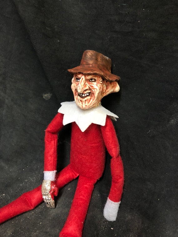 creepy elf doll