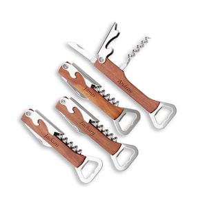 May include: Four personalized wooden wine opener tools with stainless steel components. Each opener features a corkscrew, bottle opener, and knife. The names "Andrew", "James", "Zachary", and "Jackson" are engraved on the handles.