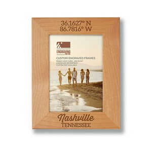 May include: A wooden picture frame with a custom engraved design. The frame features the coordinates 36.1627&deg; N 86.7816&deg; W, the text "Nashville, Tennessee", and the words "Custom Engraved Frames".