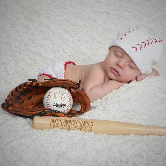 baby in baseball glove