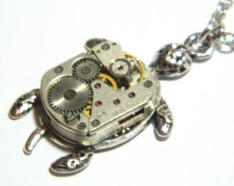 Steampunk tortoise jewelry necklace On the back of the turtle, silver colored synthetic rubies clockwork, steam punk gift honeymoon surprise