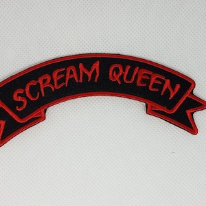 May include: Black and red embroidered patch with the text "SCREAM QUEEN" on a banner.