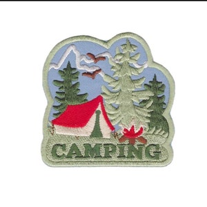 May include: An embroidered patch with a green, white, and red tent, green trees, a campfire, and the word "CAMPING" in green letters on a light blue background.